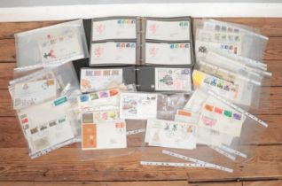 A large collection of Royal Mail First Day Covers, loose and in albums. To include Christmas,