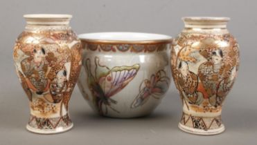 A pair of small Japanese Satsuma baluster vases along with a similar bowl decorated with