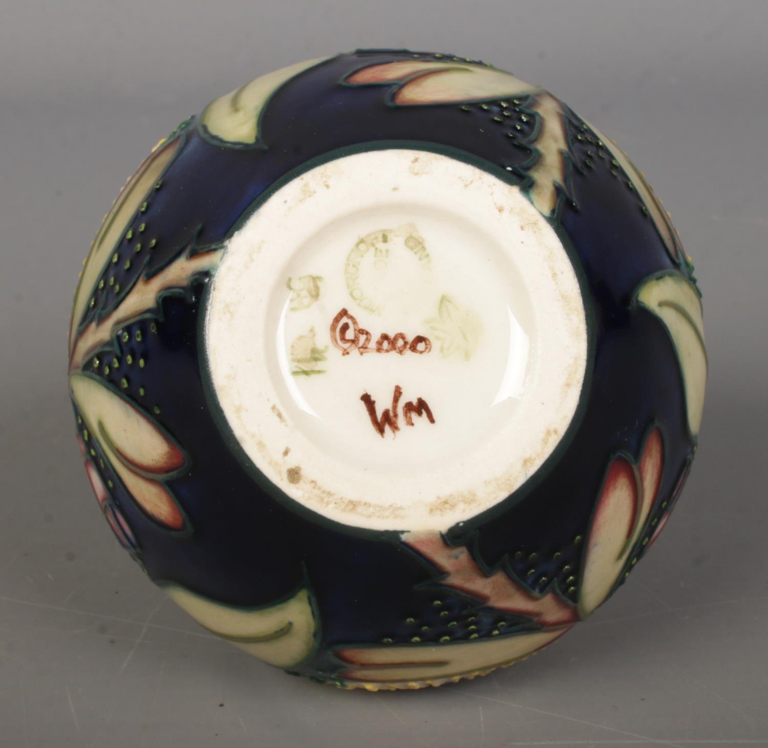 A Moorcroft pottery vase of ovoid form, in the 'Albany' pattern. 8.5cm tall. Bares leaf mark to - Image 2 of 2