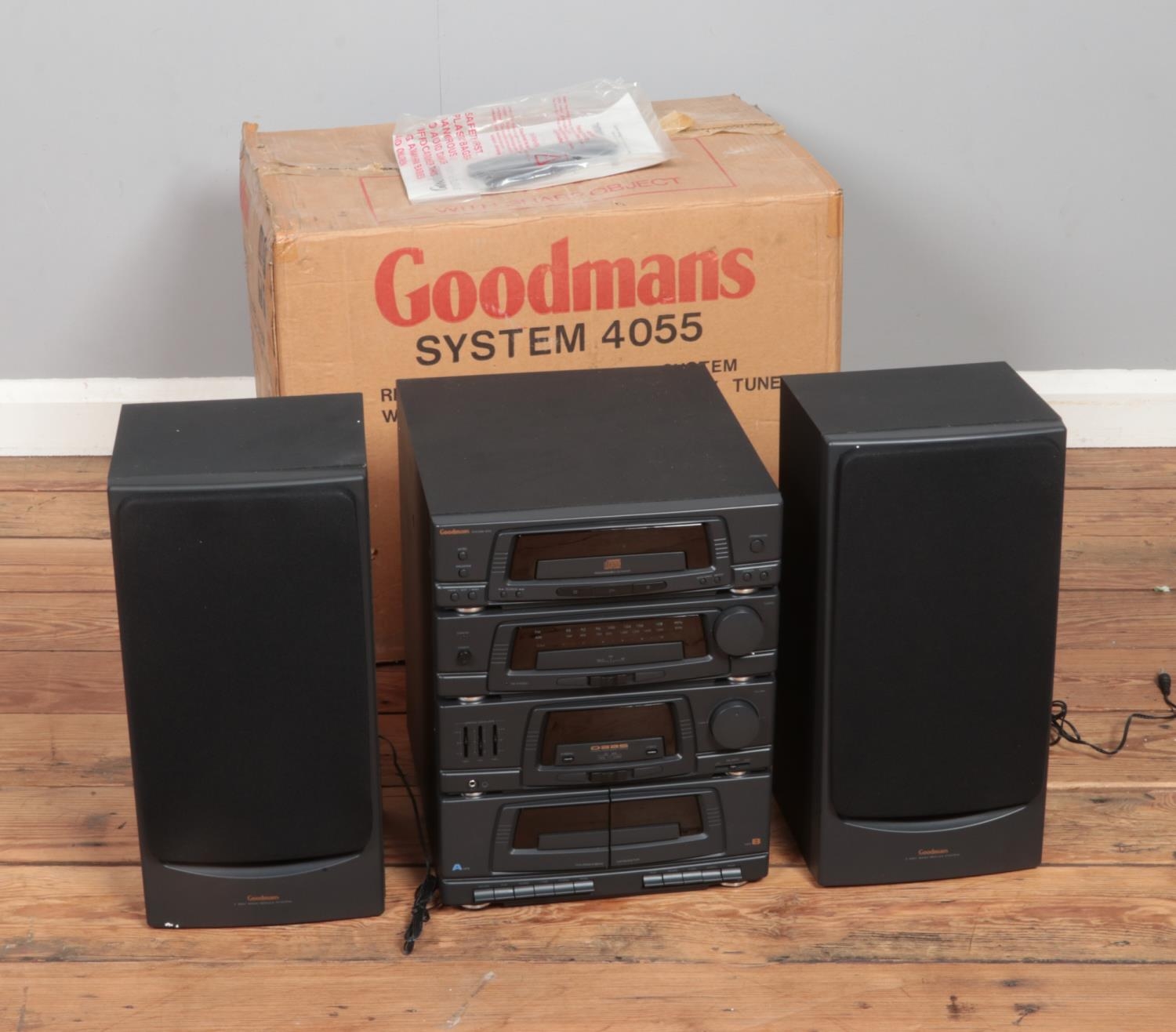 A Goodmans System 4055 remote control stereo system with CD player and rotary tuner.