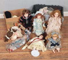 Two boxes of assorted porcelain dolls, mainly of Leonardo Collection examples.