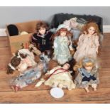 Two boxes of assorted porcelain dolls, mainly of Leonardo Collection examples.