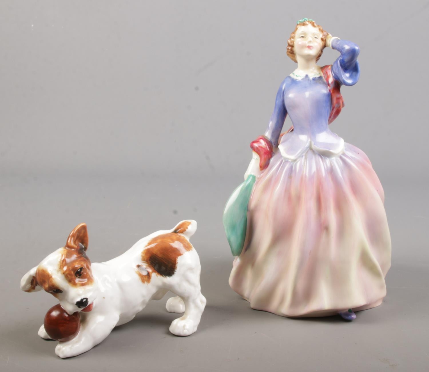 Two Royal Doulton porcelain figures. Includes Blithe Morning, HN2021 and dog with ball, HN1103.