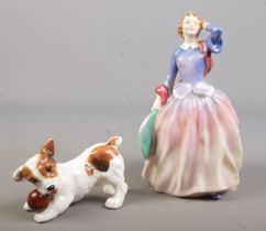 Two Royal Doulton porcelain figures. Includes Blithe Morning, HN2021 and dog with ball, HN1103.