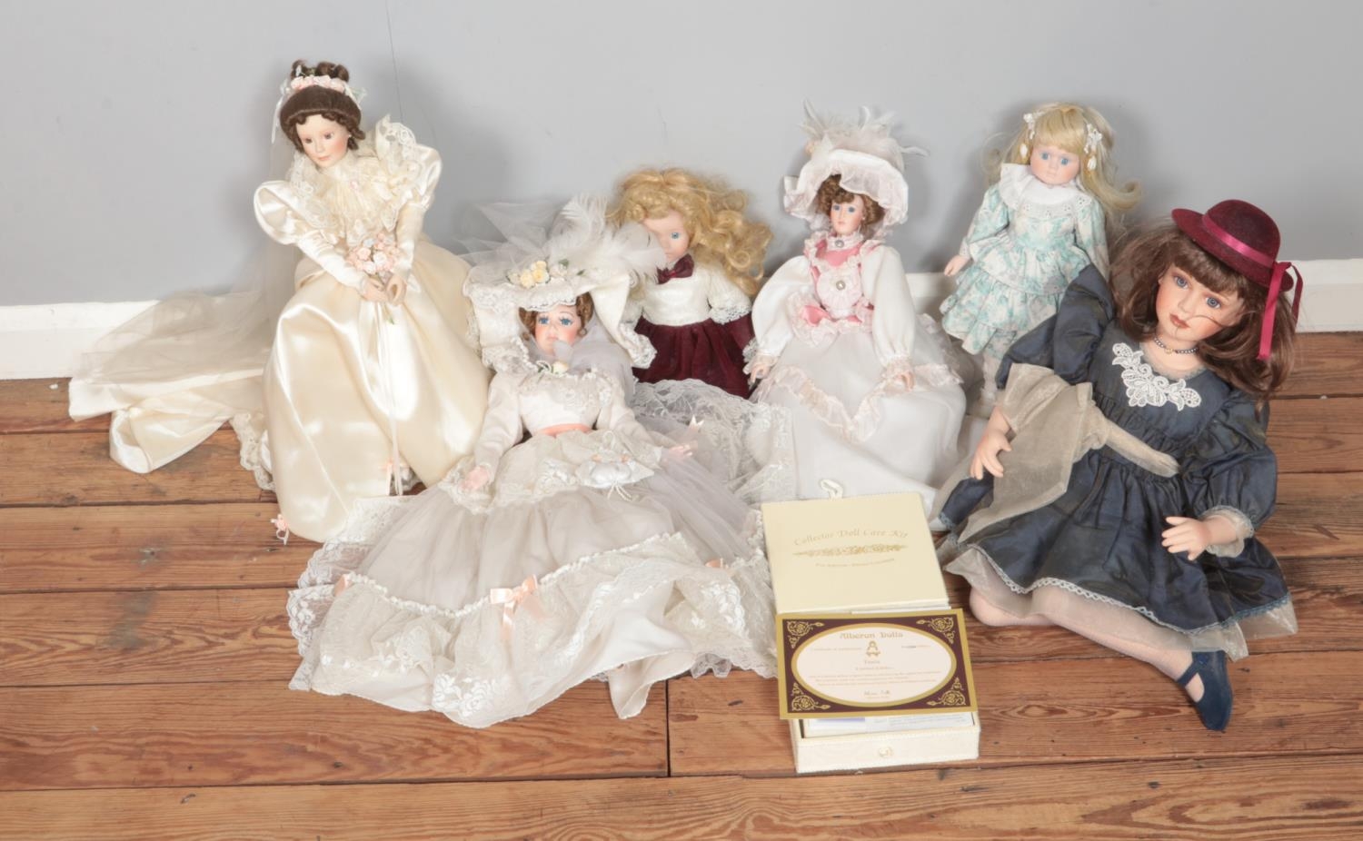 A box of assorted porcelain collectors dolls to include The Doll House Company Ascot Belle and boxed