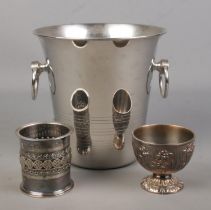 A collection of silver plated items. Includes a Guy Degrenne twin handled ice/champagne bucket, a
