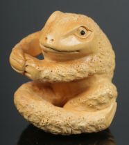 A hand carved hardwood netsuke of frog.