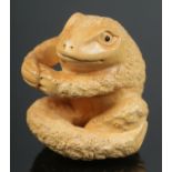 A hand carved hardwood netsuke of frog.