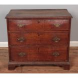 A Georgian oak Batchelors chest of drawers with brass escutcheons. Hx73cm, Wx82cm, Dx43cm.