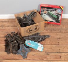 A large box full of 00 gauge track including a Hornby operating turntable set, includes some 0 gauge