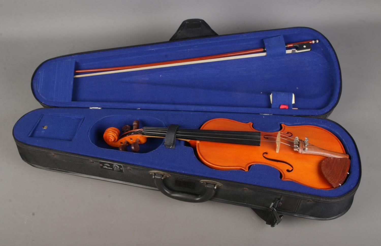 A cased Stentor Student violin with bow.