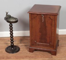 A vintage smokers stand featuring resting deer along with mahogany podonium coal cabinet.