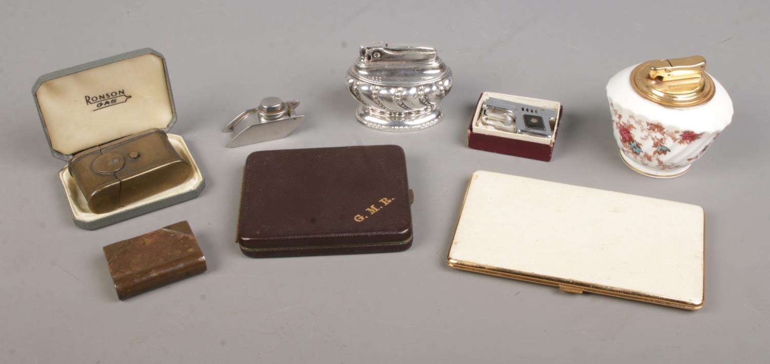 A collection of cigarette lighters, vestas and cigarette cases. To include Ronson 'Crown' lighter,