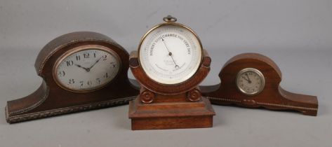 A W Heath & Co barometer together with to oak cased mantel clocks.