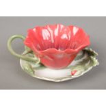 Franz 'Red Poppy' cup and saucer, number FZ00799. Both pieces in good condition.
