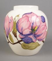 A Moorcroft Magnolia design vase on ivory background. Hx18cm. Believed to originally be a ginger jar