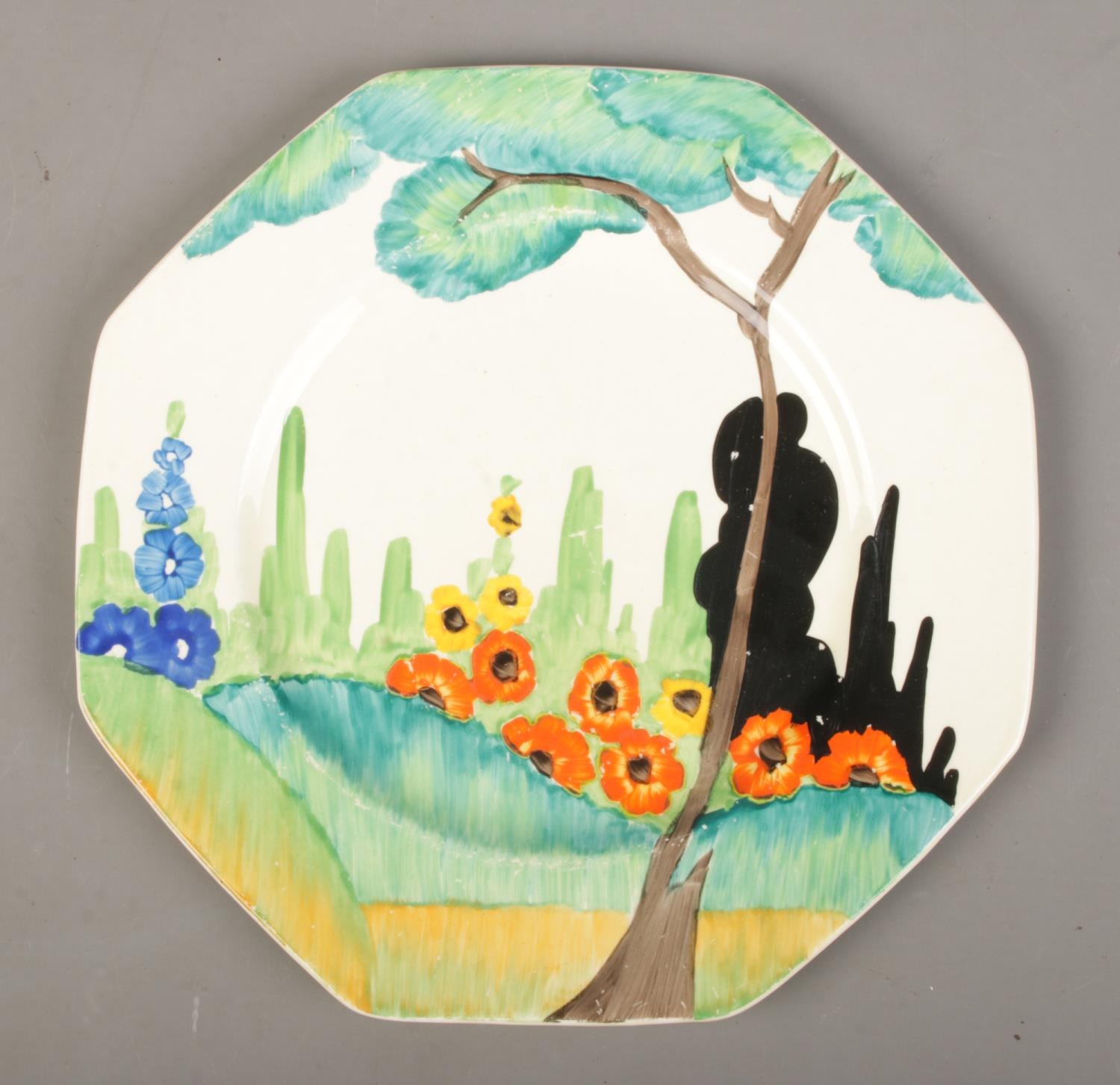 A hand painted Clarice Cliff Bizarre "Fragrance" pattern octagonal plate. Dx21.5cm