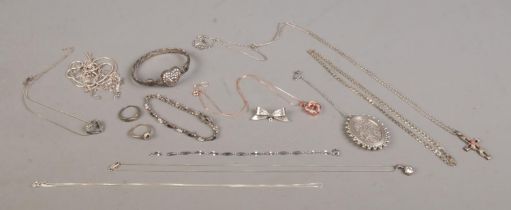 A quantity of mainly silver jewellery to include locket, bangle, rings bow brooch and necklace
