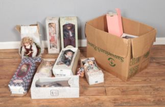 A good collection of boxed porcelain dolls, mostly Leonardo Collection examples.