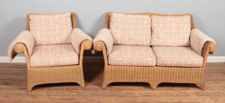 A four piece rattan conservatory suite. Comprising of a pair of two seat sofas and two armchairs.
