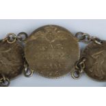 A Royal Flying Corps sweetheart coin bracelet, composed of 1914-17 50 Cenitmes coins and central