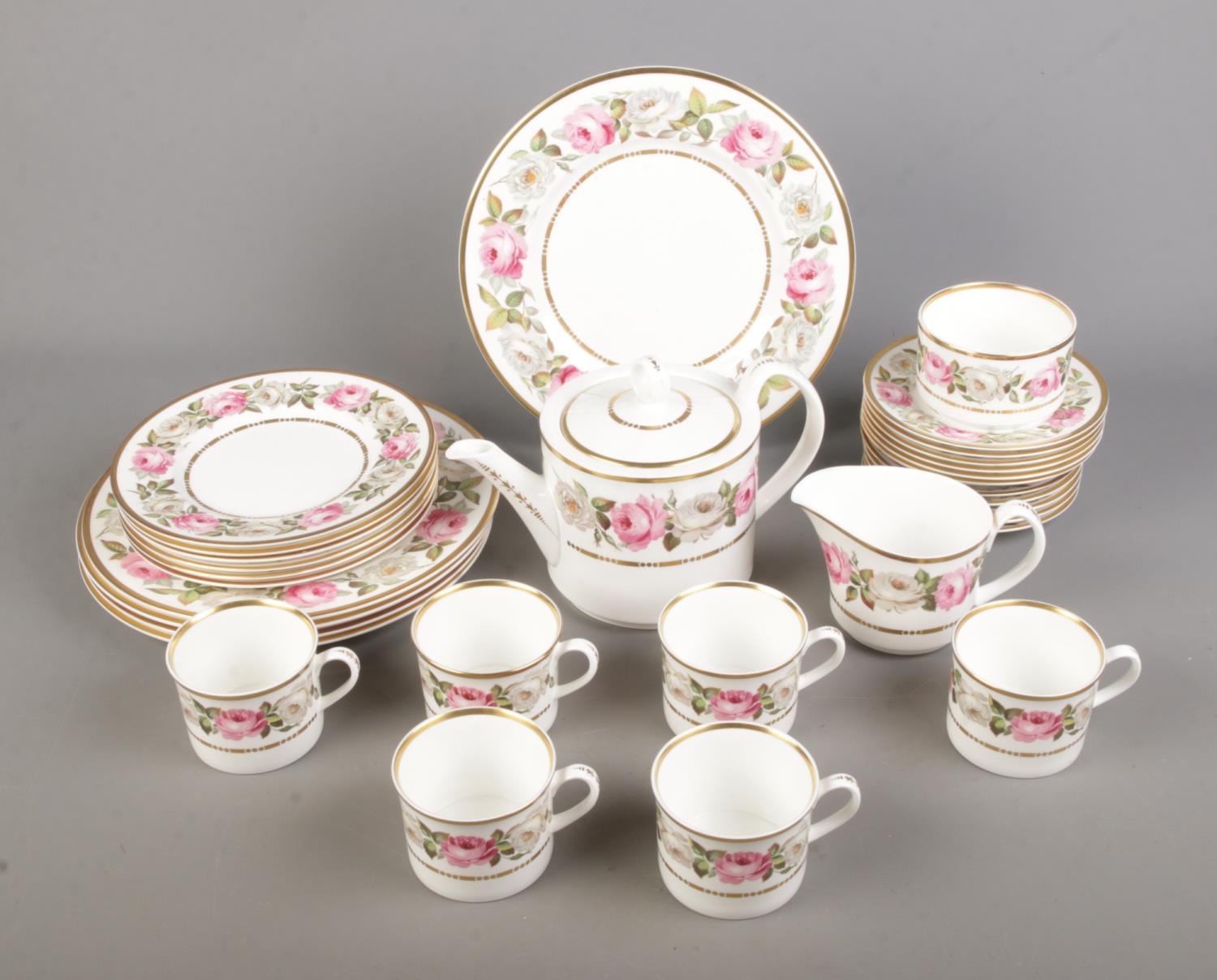 A collection of Royal Worcester tea wares in the Royal Garden pattern to include tea pot, milk