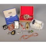 A collection of assorted costume jewellery and collectables to include brooches, Women's Land Army