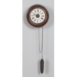 A mahogany postman's alarm clock featuring enamel dial with roman numeral markers