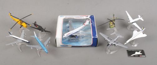 Nine scale model aircraft, including Corgi CS90338 Concorde, CS90384 Wessex Helicopter, CS90335