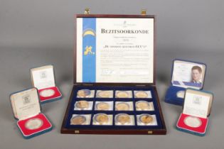 Four cased commemorative silver coins. Including Prince Harry Twenty First Birthday Â£5 coin,