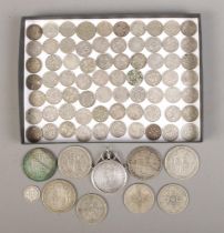 A quantity of pre 1947 British silver coinage. Includes half crowns, florins and three pence pieces.