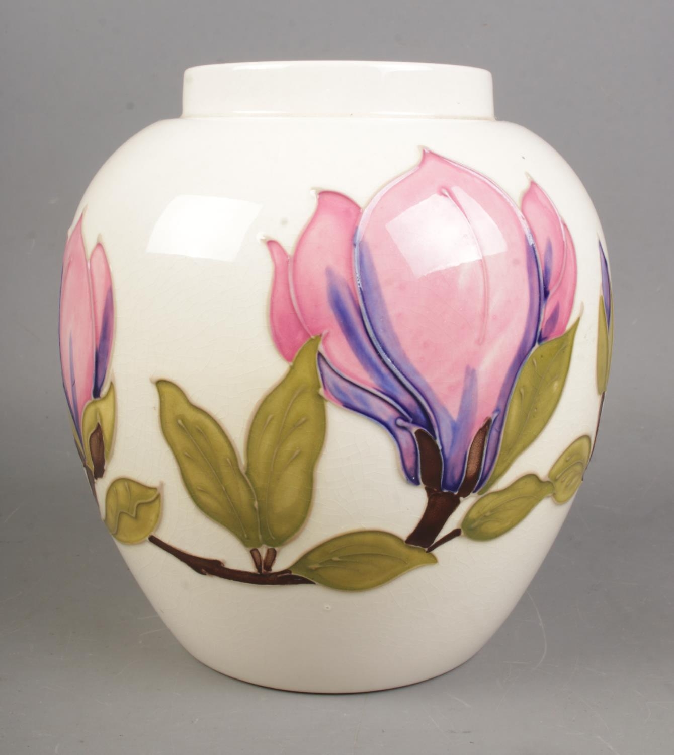 A Moorcroft Magnolia design vase on ivory background. Hx18cm. Believed to originally be a ginger jar - Image 2 of 3