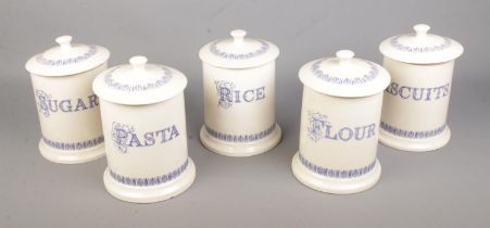 A collection of Ditto blue and cream storage jars to include biscuits, pasta, flour, rice, etc.