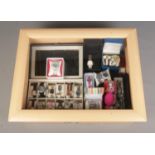 A table top display case containing an assortment of watches, mainly quartz examples. To include