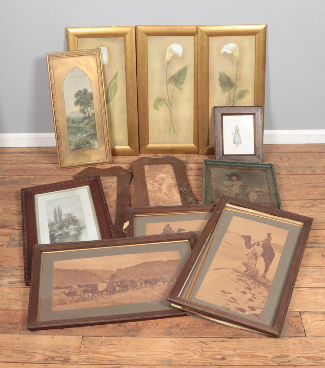 A collection of large framed prints including floral examples, Egyptian theme, Lucien Davis prints