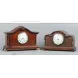 Two wooden cased mantle clocks, both with brass column supports. To include an oak cased example
