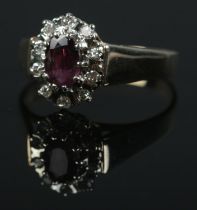 A 9ct gold ruby and diamond ring. Size R 1/2. 3.2g.
