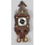 A Dutch brass and oak mounted wall clock, 20th century, the silvered dial with black Roman