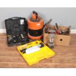 A collection of power tools including Mac Hammer drill, Laser tool, Vas hoover and other tools