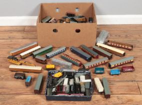 A large box of model railway trains and carriages including Hornby, Lima and Tri-ang examples.