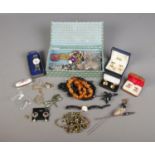 A box of assorted costume jewellery. To include amber beads, Mortima 17 Jewels necklace watch,