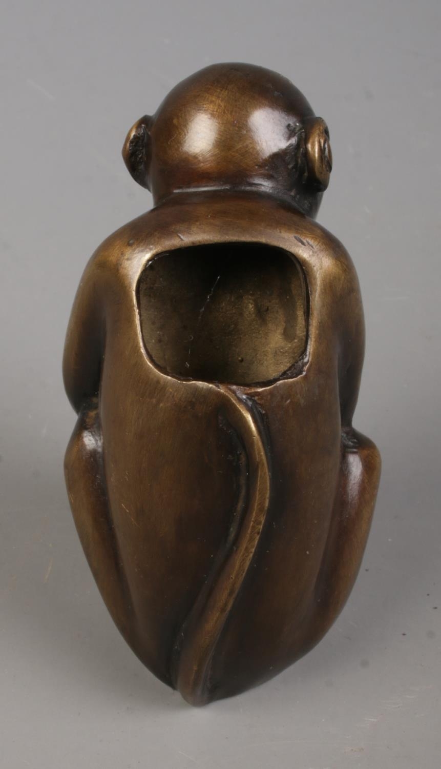 A bronze figure formed as a seated monkey. Approx. height 8cm. - Bild 2 aus 2