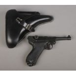 A replica Denix P-08 Parabellum pistol, in reproduction holster, stamped P08, 1941. Pistol stamped