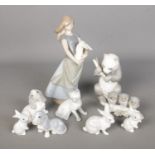 A collection of Nao by Lladro and John Jenkins figures to include Giant Panda, cat, girl with