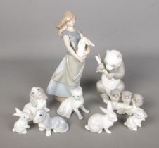 A collection of Nao by Lladro and John Jenkins figures to include Giant Panda, cat, girl with