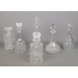 Six cut and pressed glass decanters. Replacement tops to some examples.