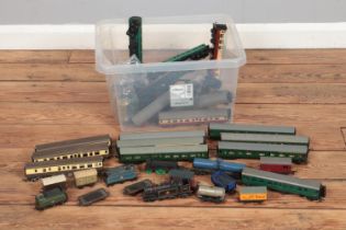 A large collection of model trains and carriages including various carriages, tank cars, rail flat