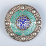 After Alexander Ritchie silver and enamel brooch formed as a Celtic shield. Hallmarked Birmingham