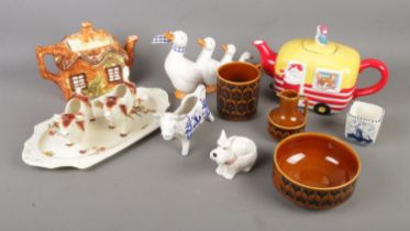 A collection of assorted ceramics to include Delfts, Hornsea, novelty tea pot, creamers, etc.