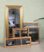 Five assorted mirrors, to include gilt framed and bevel edged examples.